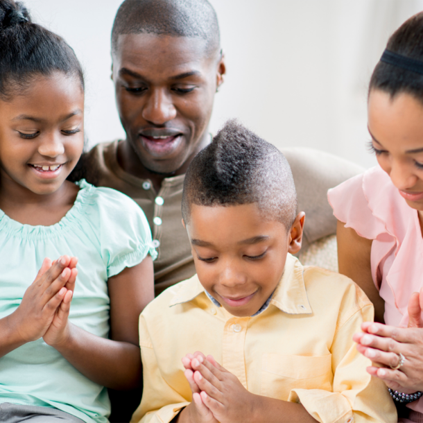 family praying together