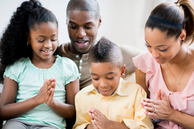 family praying together