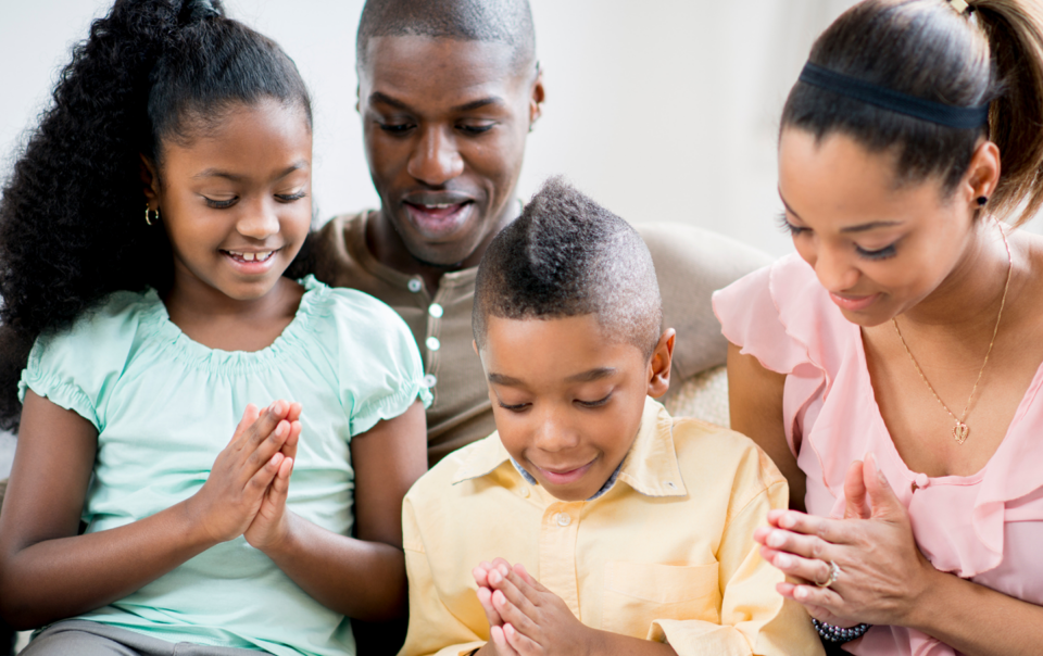 family praying together