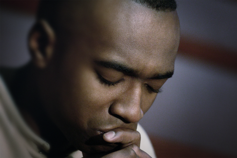 black man praying